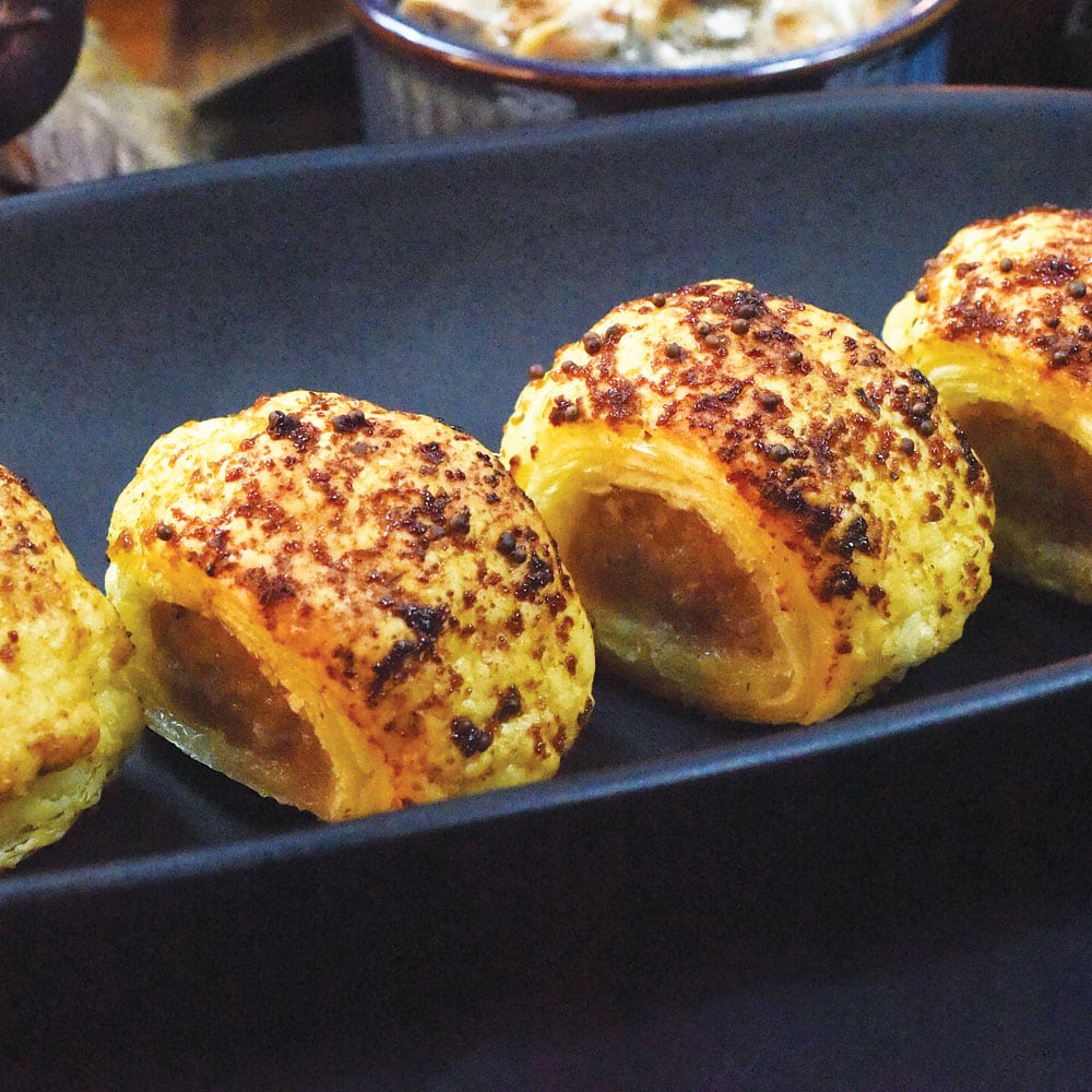 Honey & Mustard Mini Sausage Rolls using Arthur Pipkins Honey & Mustard Sausage Mix, pastry brushed with AVO Honey & Mustard Lafiness Marinade.