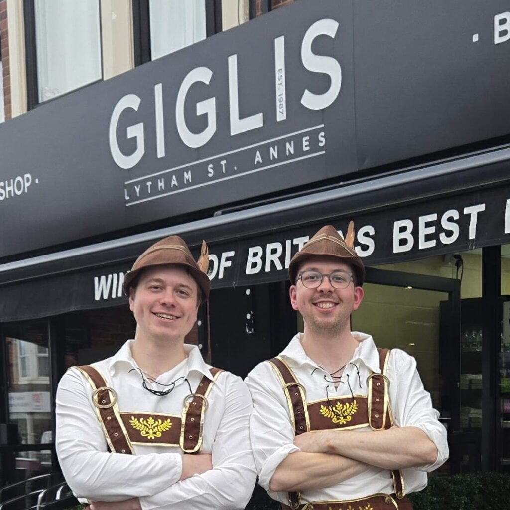 Butchers from Gigli's in Lytham wearing Oktoberfest lederhosen outfits