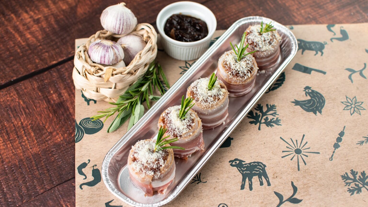 Bacon-wrapped smoked apple and cinnamon stuffing bites topped with cranberry, Parmesan and rosemary